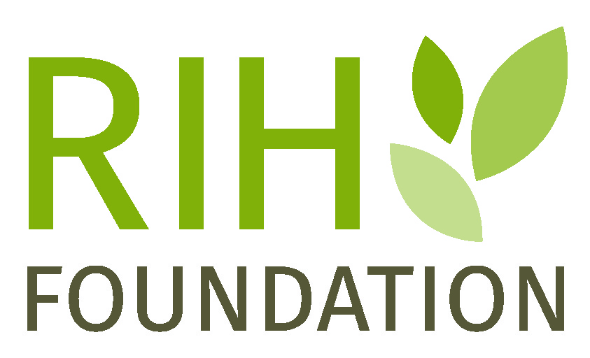 A logo with the words RIH Foundation stacked vertically (RIH text is green and Foundation text is brown) with leaves in different shades of green to the right of the word RIH.