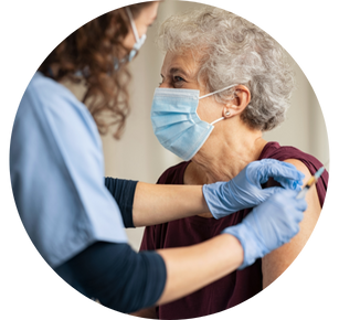 Senior receives a vaccine from a health-care professional.