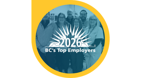 A white logo, placed in the middle of a group photo, that says 2026 BC's Top Employers.