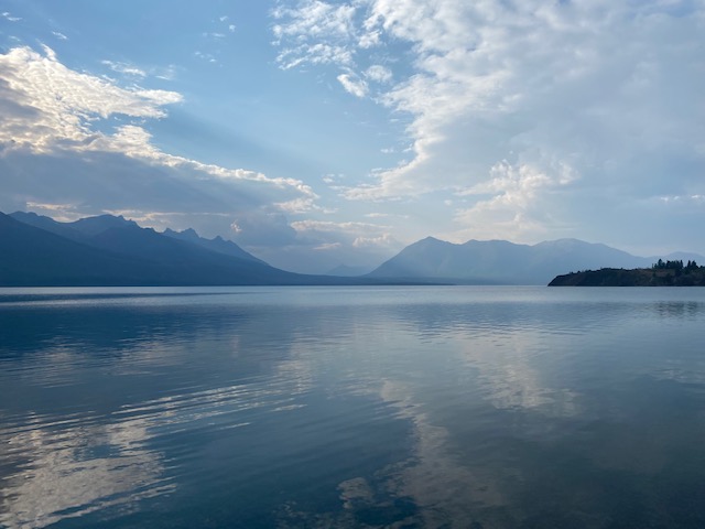 A nature scene featuring a calm lake.