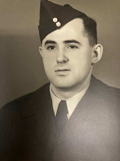 A older black and white photo of a person wearing a Canadian Air Force uniform.