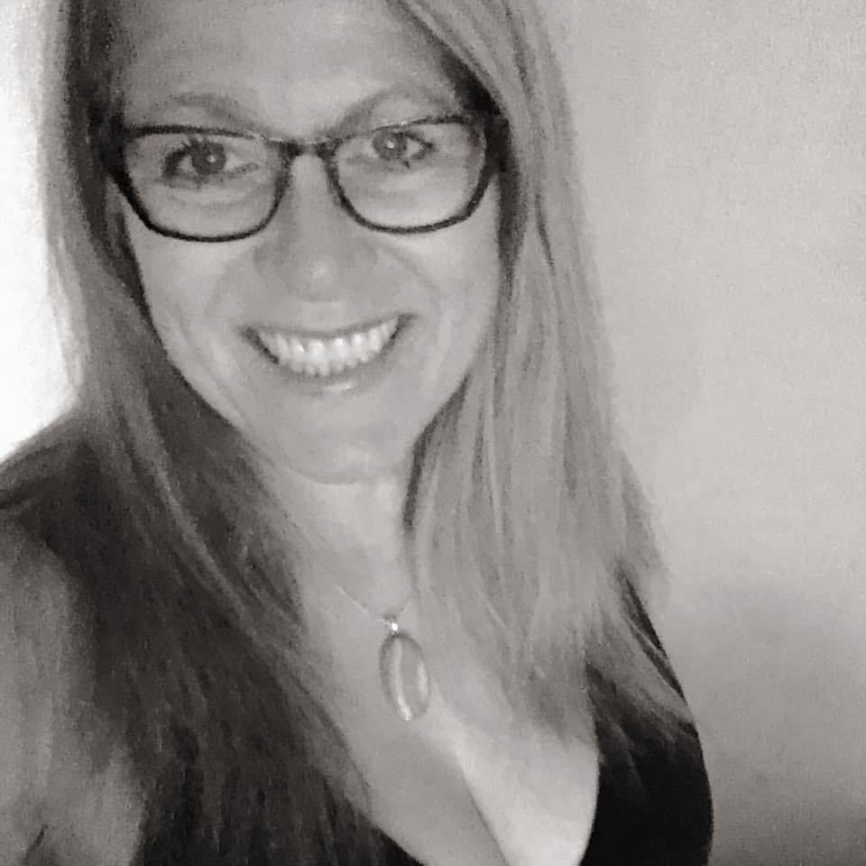 Black and white filtered selfie of a women smiling