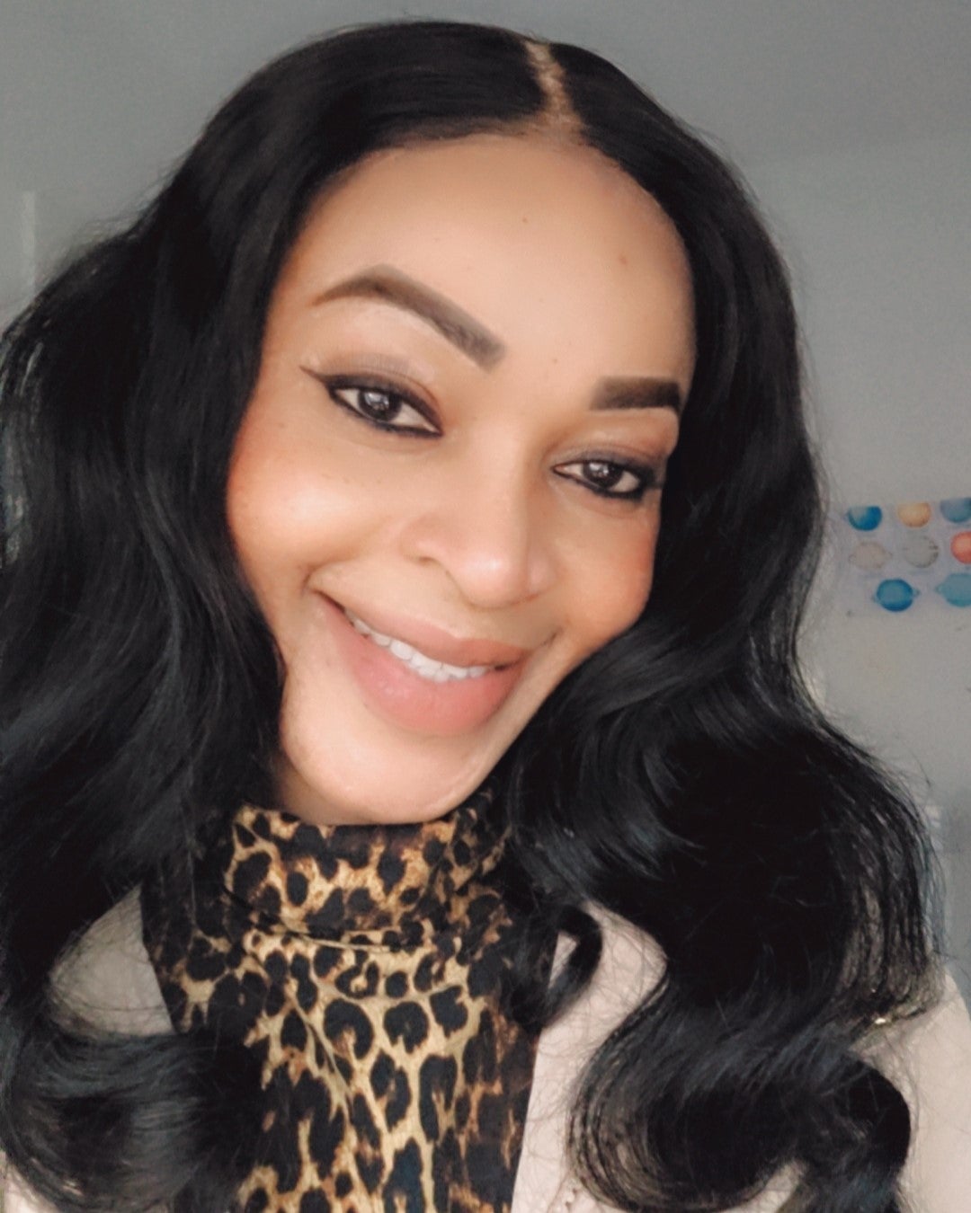 Selfie of an internationally educated nurse smiling warmly