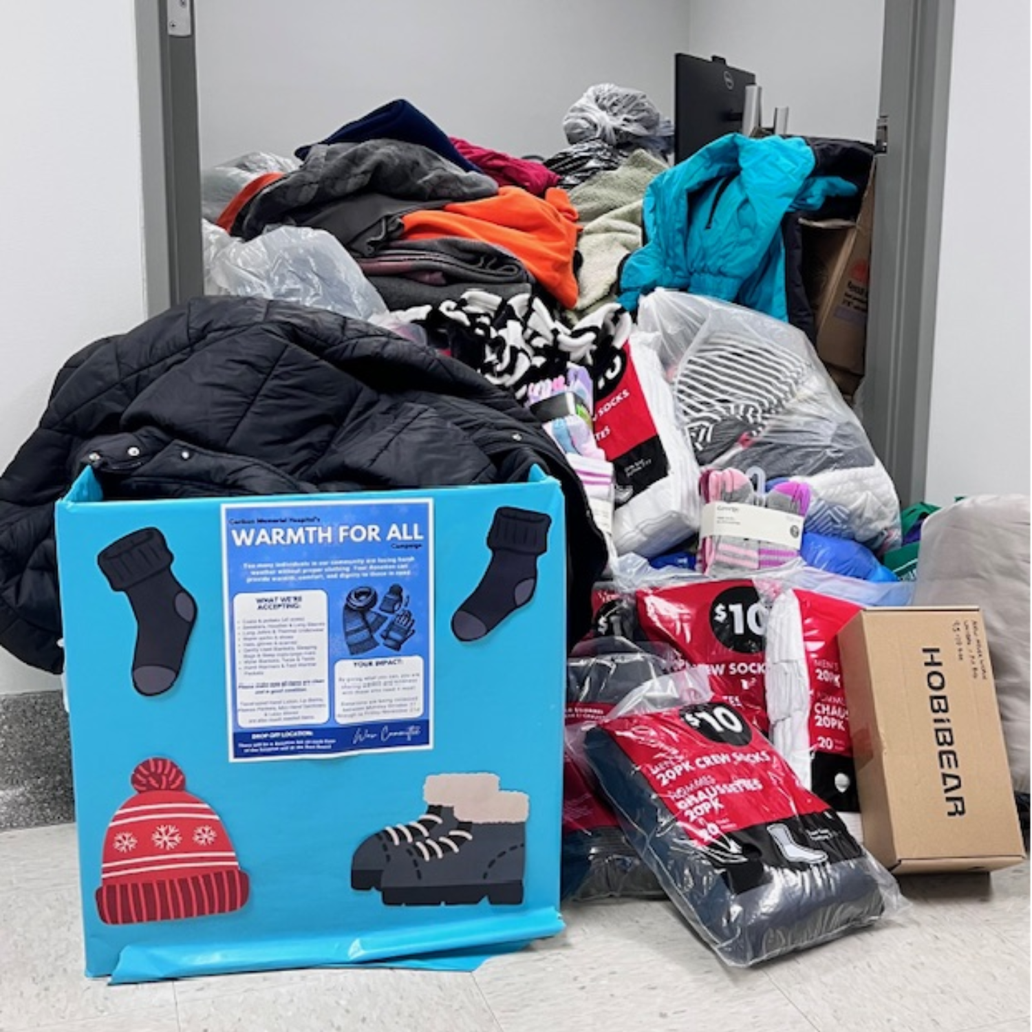 pile of clothes and shoes in an office