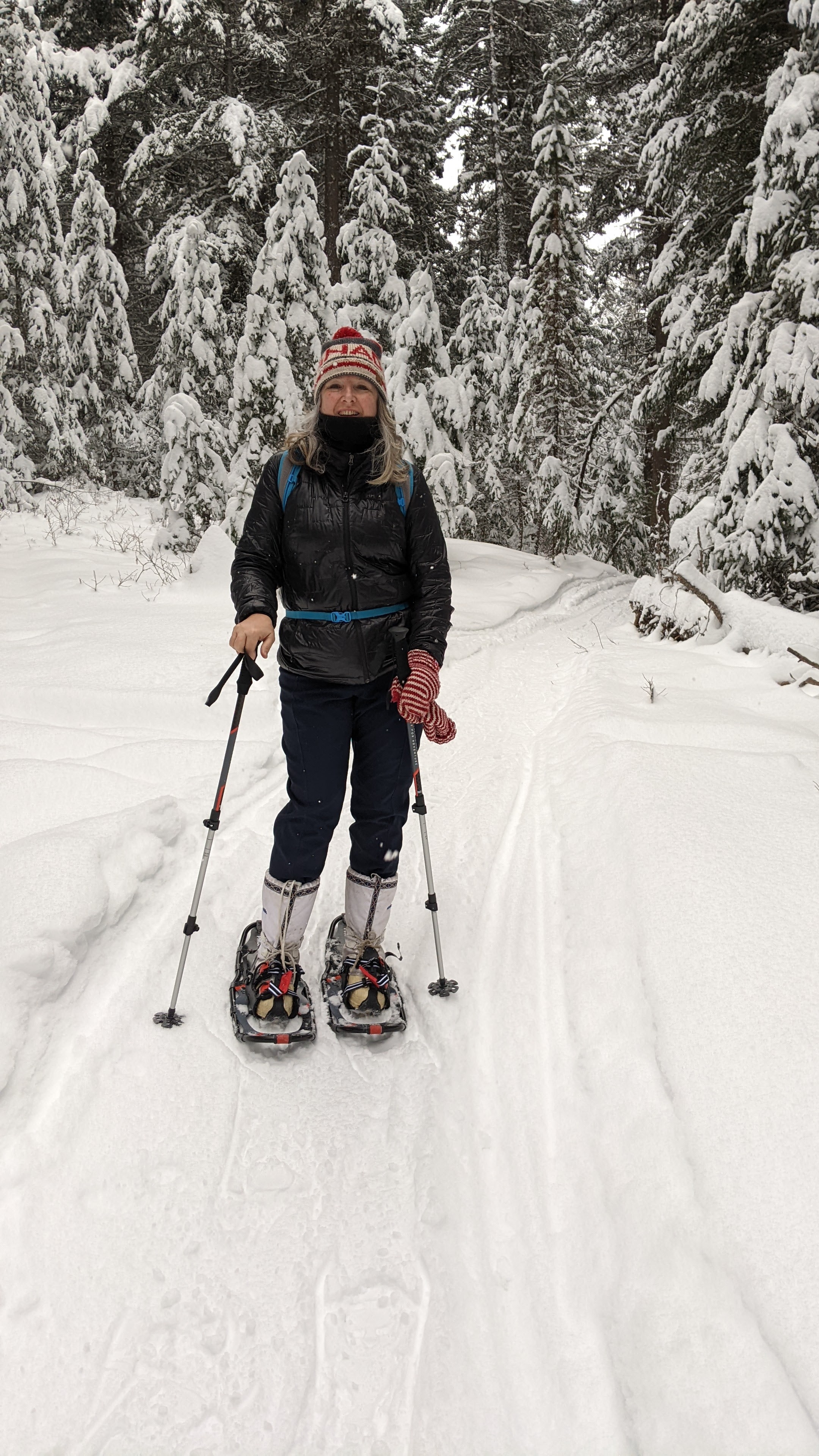 A woman on a snowshoe adventure in the forest