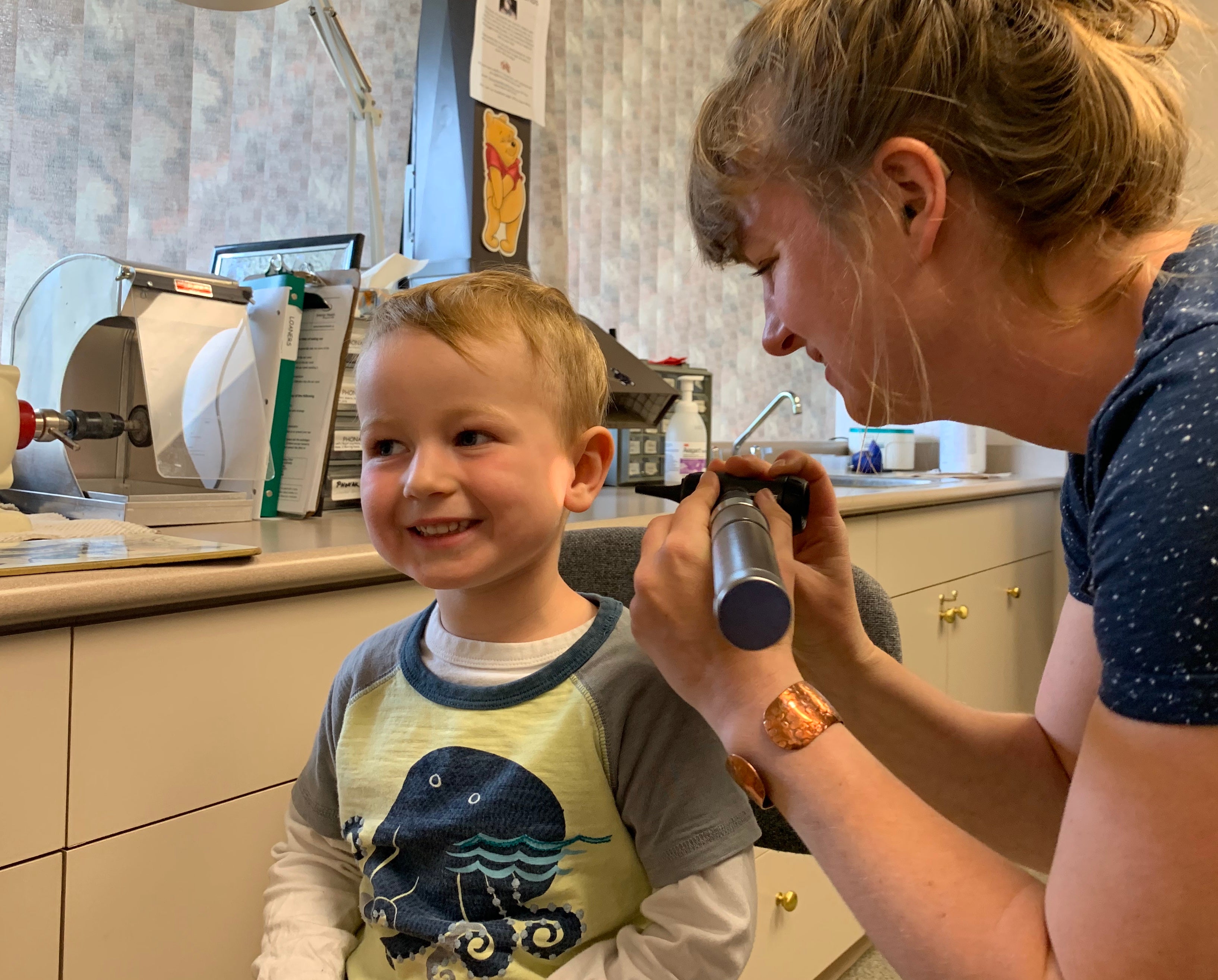 A child getting his ear examined.