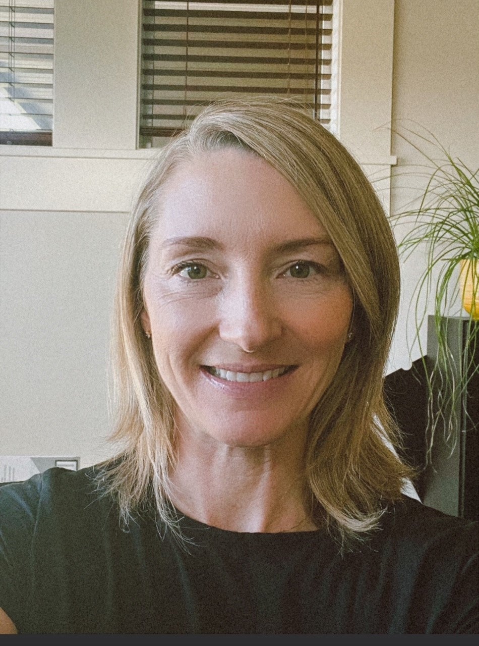 a smiling person taking a selfie