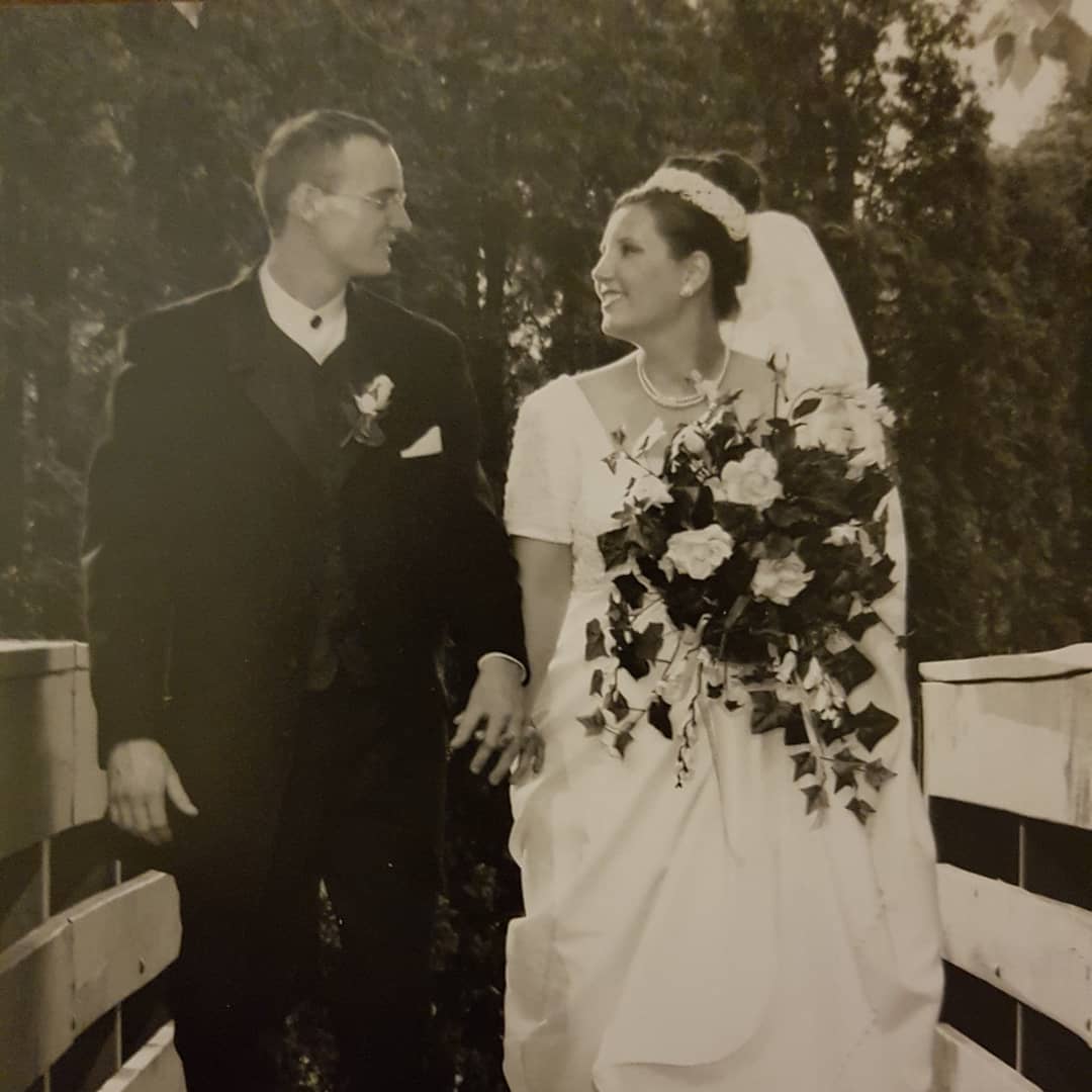 Black and white photo of groom and bride looking at each other.