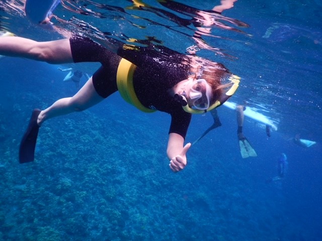 An underwater picture of a person in snorkel gear