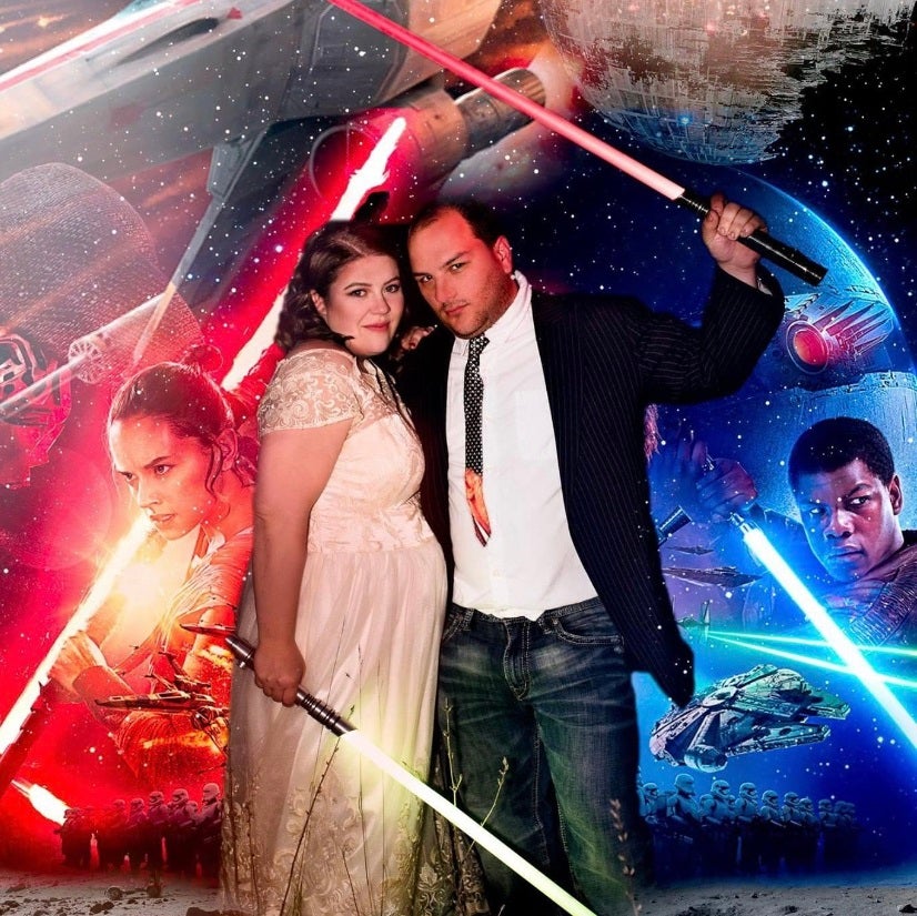 a woman and man are married dressed as Jedi’s holding lightsabers against a Star Wars-themed background