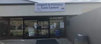 A building with a sign reading Urgent & Primary Care Centre.
