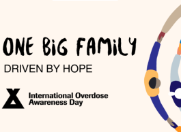 A banner with a beige background and colourful circles next to the words One Big Family Driven by Hope
