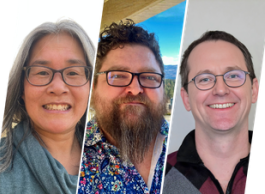 three people wearing glasses smiling to camera