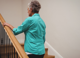 Person walking up stairs in a house